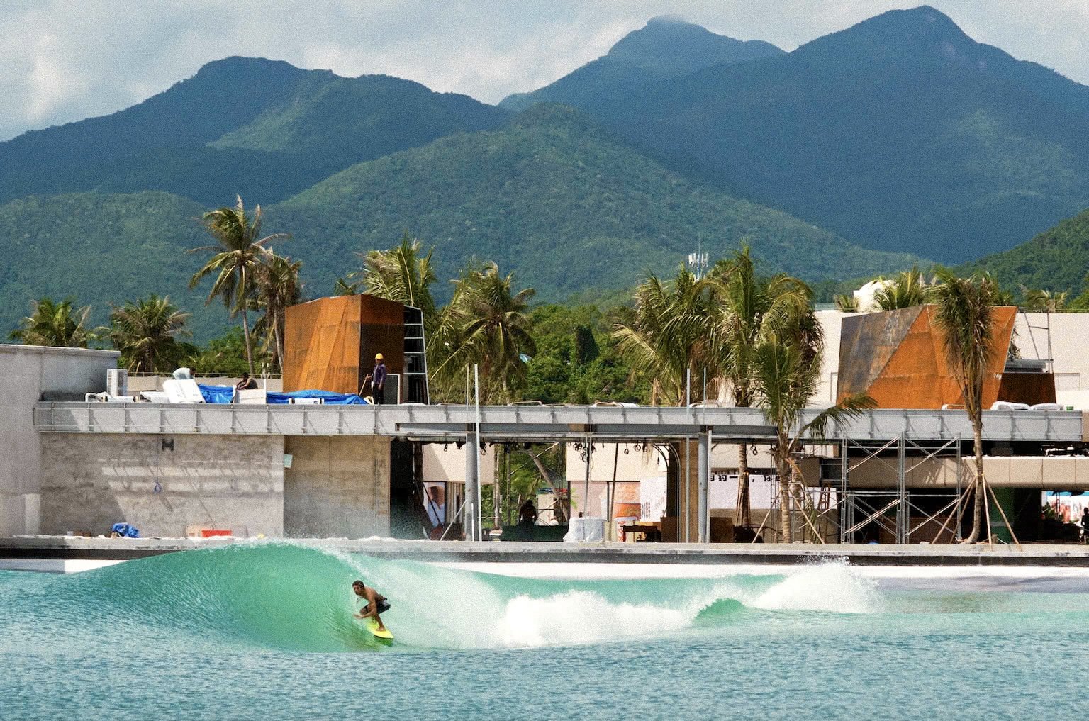 Surfer tucked into a barrelling wave at the PerfectSwell surf pool